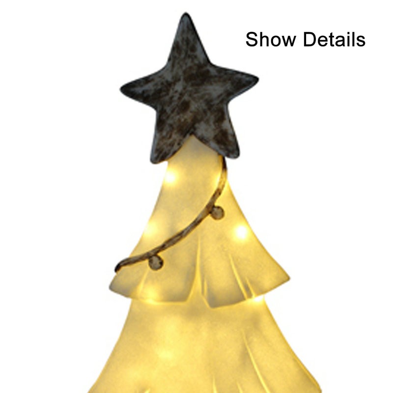 砂岩ランプクリスマスのためにトップスターのある明るい木